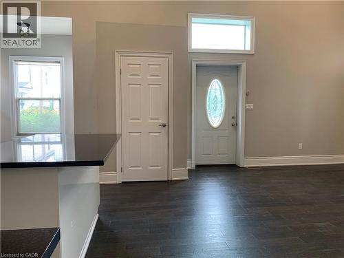 Unit 1 Open concept living space featuring dark wood-finish flooring - 405 Macnab Street N, Hamilton, ON 
