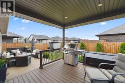 Covered patio with composite decking and recessed lighting - 