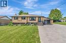 Split-level residence featuring a stucco and stone facade with dark trim windows - 192 Myers Road, Cambridge, ON 
