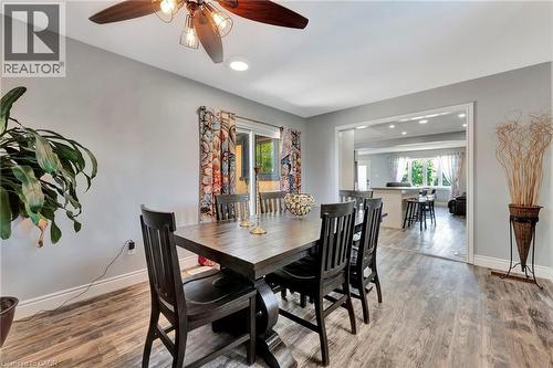 Dining area featuring wood-finish flooring, recessed lighting, and a ceiling fan with light fixture - 192 Myers Road, Cambridge, ON 