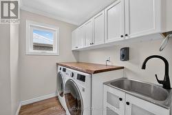 Main floor Laundry with closet + access to garage - 