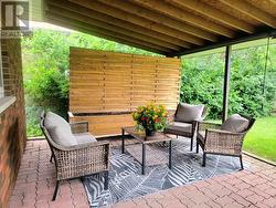 Covered Patio Located In Backyard - 