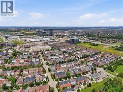 Expansive aerial view showcasing a dense residential community with varied architectural styles - 