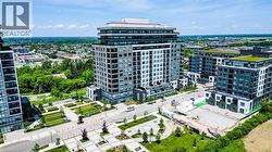 Contemporary high-rise building featuring a multi-story facade with balconies, extensive window-lines, and a flat roofline - 