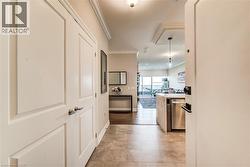 Foyer featuring large format tile flooring and white panel doors - 
