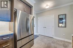 Stainless steel French door refrigerator set within custom cabinetry - 