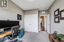 Carpeted room with neutral wall tones and a white bi-fold closet door - 