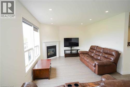 Living area with light-colored walls and recessed lighting - 187 Adler Drive, Cambridge, ON - Indoor Photo Showing Living Room With Fireplace