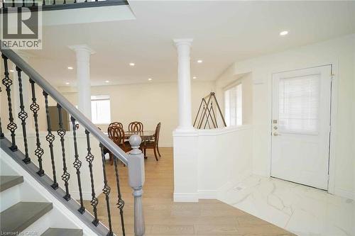 Foyer with white marble-look tile flooring and recessed lighting - 187 Adler Drive, Cambridge, ON - Indoor Photo Showing Other Room
