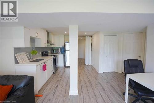 Open-concept living space featuring wood-finish flooring throughout - 187 Adler Drive, Cambridge, ON - Indoor Photo Showing Kitchen