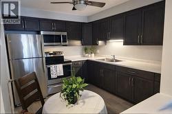 new kitchen with new counter tops, double sink, new lighting and floors - 