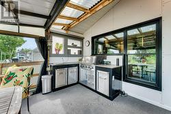 Deck off Kitchen with outdoor cooking centre. - 