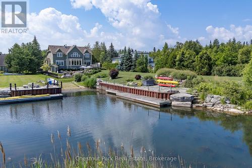 View of the back yard and dock & kayak storage - 176 Bartlett Boulevard, Collingwood, ON 