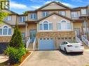 Multi-level townhome featuring a stone and siding facade - 214 Snowdrop Crescent, Kitchener, ON 