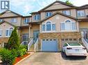 Light beige siding exterior with stone facade accents - 214 Snowdrop Crescent, Kitchener, ON 