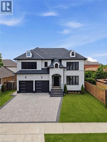 Contemporary residence featuring a light-colored stone and stucco facade - 62 Jeremy Street, Hamilton, ON 