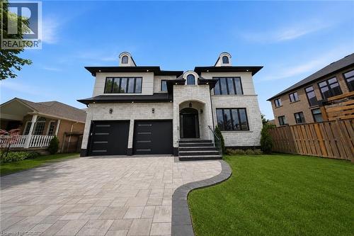 Contemporary stone facade with black trim windows - 62 Jeremy Street, Hamilton, ON 