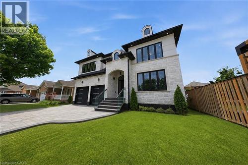 Contemporary stone and stucco facade with black-framed windows - 62 Jeremy Street, Hamilton, ON 