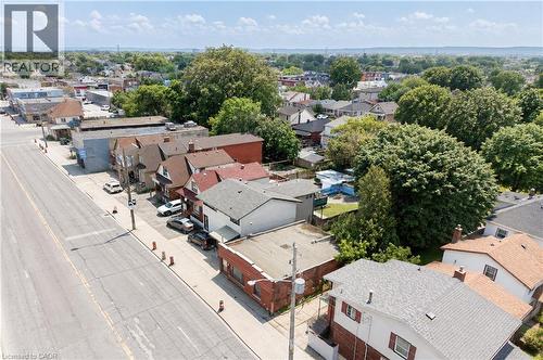 Aerial perspective showcasing a mixed-use neighborhood with residential and commercial properties - 1274 Barton Street E, Hamilton, ON 