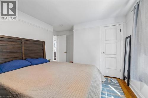 Room featuring wood-finish flooring and white painted walls with crown molding - 80 Maclennan Avenue, Hamilton, ON - Indoor Photo Showing Bedroom
