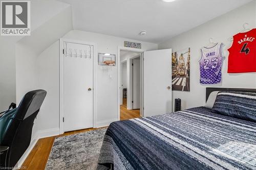 Hardwood flooring complemented by a gray area rug - 80 Maclennan Avenue, Hamilton, ON - Indoor Photo Showing Bedroom