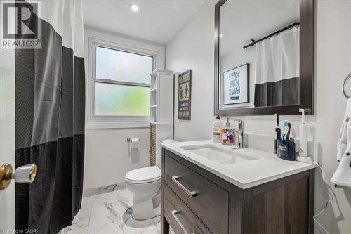 Vanity with a rectangular undermount sink, a white countertop, and chrome faucet - 80 Maclennan Avenue, Hamilton, ON - Indoor Photo Showing Bathroom