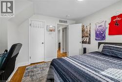Hardwood flooring complemented by a gray area rug - 