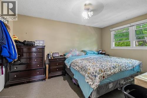 Room with neutral-toned walls, textured ceiling, and carpeted flooring - 80 Maclennan Avenue, Hamilton, ON 