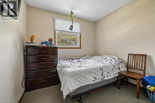 Neutral tone wall paint with a single window featuring horizontal blinds - 80 Maclennan Avenue, Hamilton, ON 