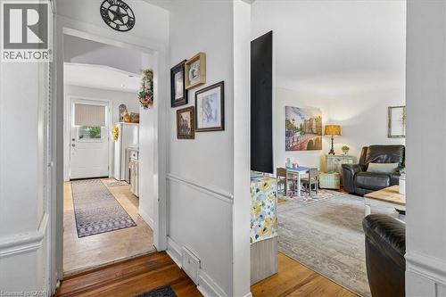 Hardwood flooring in main areas with a white trim package - 80 Maclennan Avenue, Hamilton, ON - Indoor Photo Showing Other Room