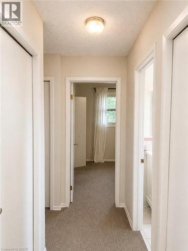 Recessed ceiling light fixture illuminating the carpeted hallway - 80 Maclennan Avenue, Hamilton, ON - Indoor Photo Showing Other Room