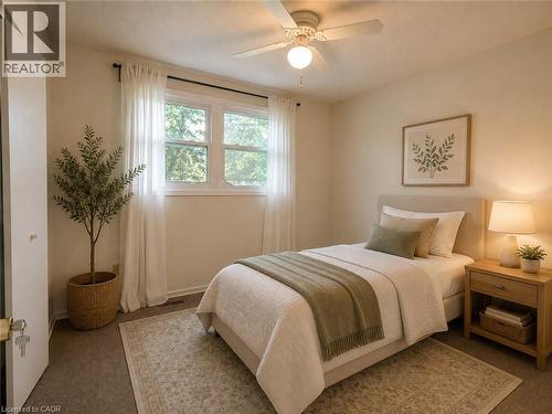 Neutral wall color, ceiling fan with integrated lighting, wood-framed window, and wall-to-wall carpeting - 80 Maclennan Avenue, Hamilton, ON - Indoor Photo Showing Bedroom