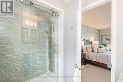 Frameless Glass Shower with Rainfall Tower Panel - 