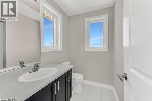 Modern vanity with a light-toned countertop and an undermount sink - 19 Picardy Drive Unit# 9, Hamilton, ON 