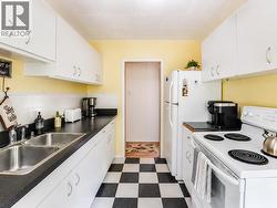 This image has been virtually enhanced by de-cluttering and light staging - 