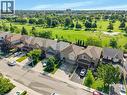 Aerial perspective showcasing residential properties bordering a manicured green space - 409 Jacqueline Boulevard, Hamilton, ON 