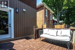 Expansive wood-finish deck with wooden railings - 