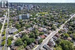 Expansive aerial capture showcasing a dense residential area with mature tree canopy - 