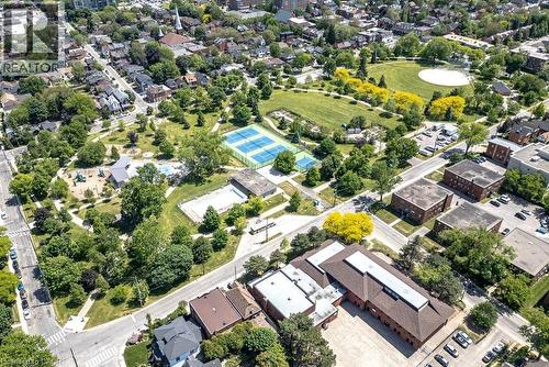 Extensive parkland featuring tennis courts, a swimming pool, and a playground - 148 Dundurn Street N, Hamilton, ON 
