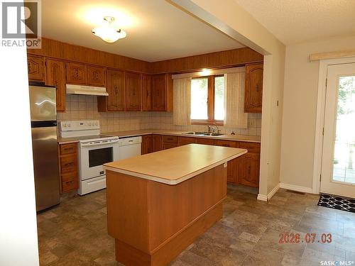 710 3Rd Street E, Assiniboia, SK - Indoor Photo Showing Kitchen With Double Sink