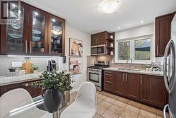 Lit display cabinet and stainless steel appliances - 