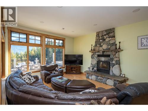 8840 Olson Road, Kaslo, BC - Indoor Photo Showing Living Room With Fireplace