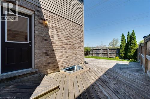 Expansive wood deck with geometric plank pattern - 928 Dunblane Court, Kitchener, ON - Outdoor With Deck Patio Veranda With Exterior