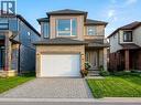 Modern-style home featuring a two-story elevation with mixed materials including brick and horizontal siding - 766 Freeport Street, London, ON 