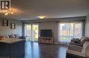 Open-concept living area with dark wood-finish flooring - 766 Freeport Street, London, ON 