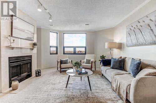 903 - 549 Ridout Street N, London East (East F), ON - Indoor Photo Showing Living Room With Fireplace