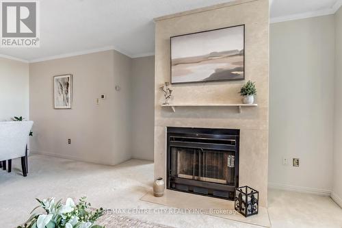 903 - 549 Ridout Street N, London East (East F), ON - Indoor Photo Showing Living Room With Fireplace