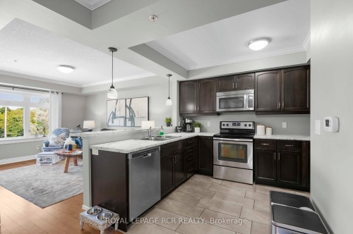 307-245 Scotland Street, Centre Wellington, ON - Indoor Photo Showing Kitchen With Stainless Steel Kitchen With Double Sink