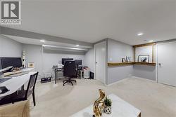 Spacious room featuring light gray walls and recessed lighting - 