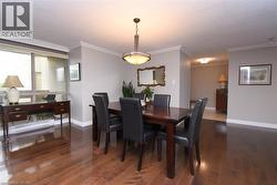 Rich wood-finish flooring complements the neutral wall tones - 